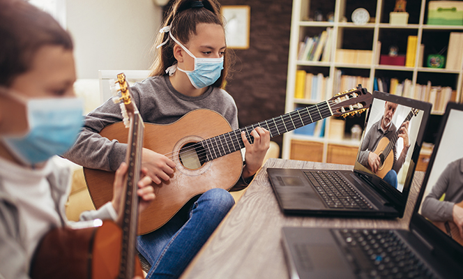 woman playing guitar | Creativity during COVID