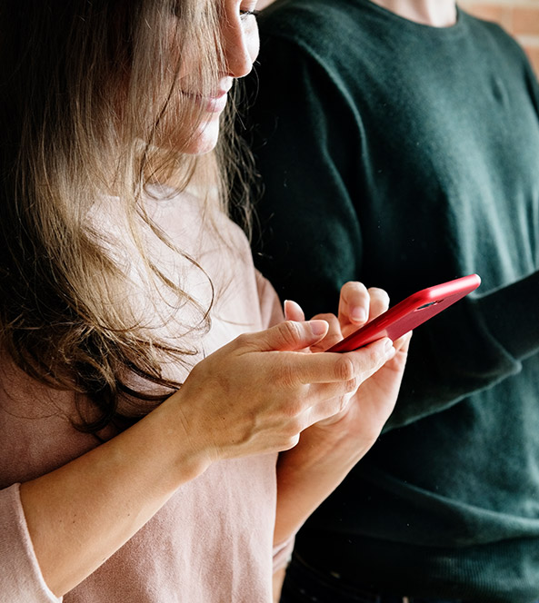 woman typing on phone