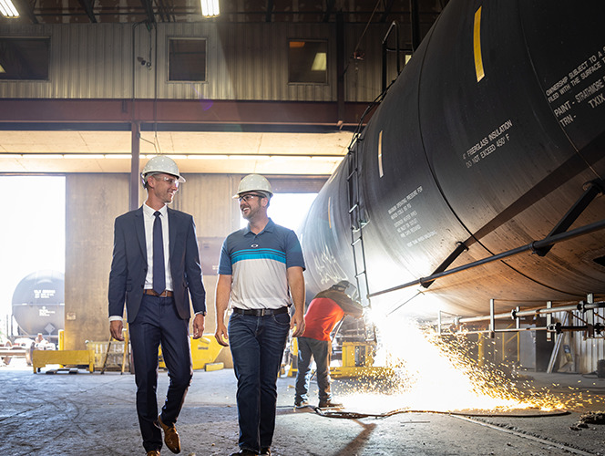 men walking with hard hats