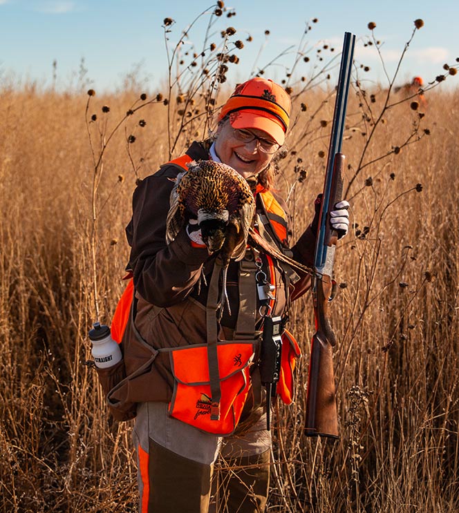 hunter holding pheasant