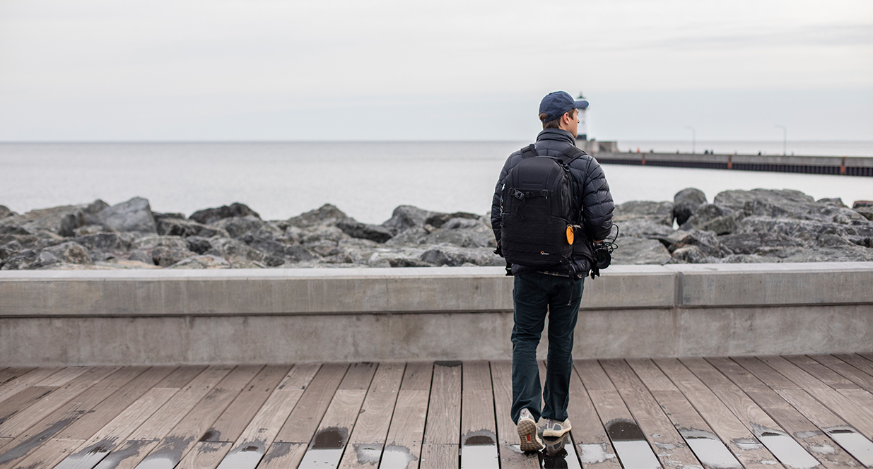 man standing on the boardwalk