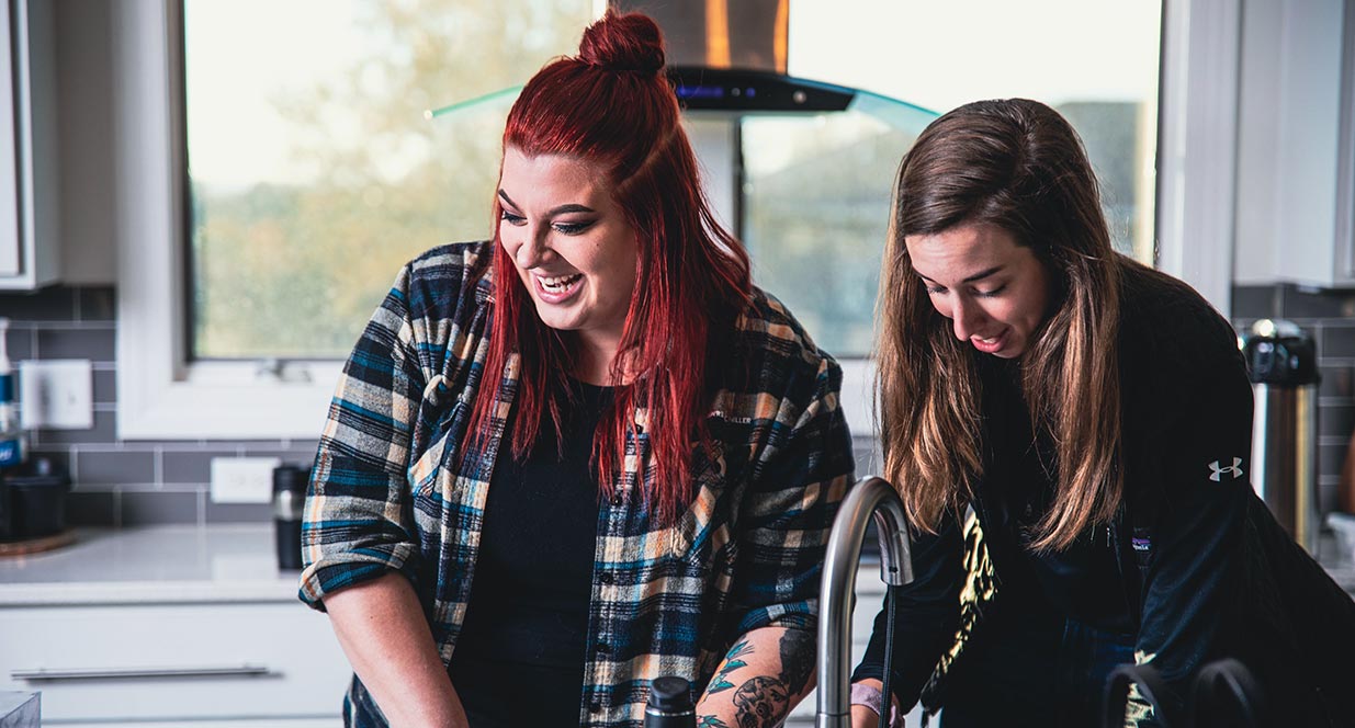 two girls working behind the scenes