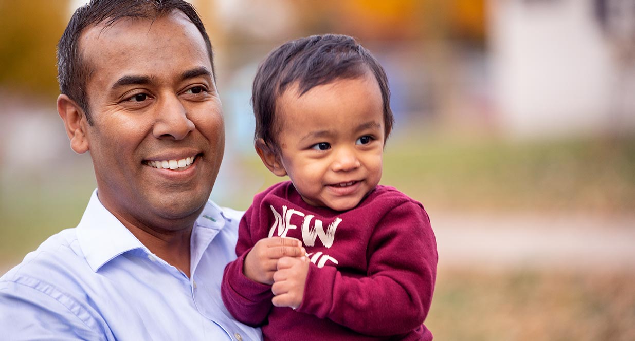 Man holding baby boy