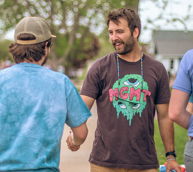 men shaking hands and smiling