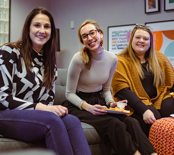 Three women smiling