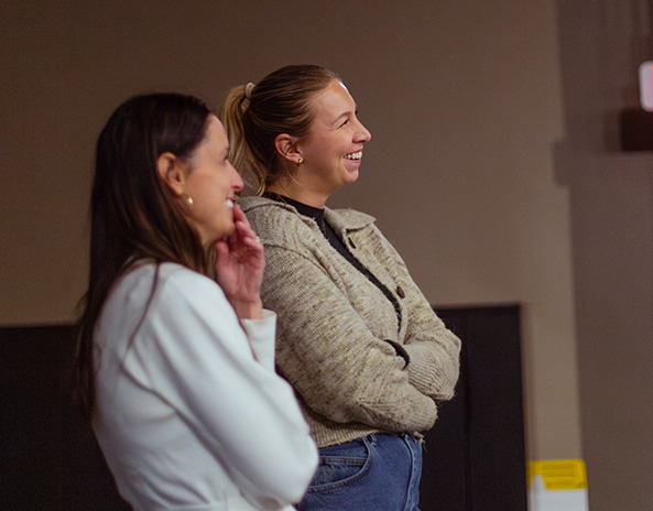 Two women smiling