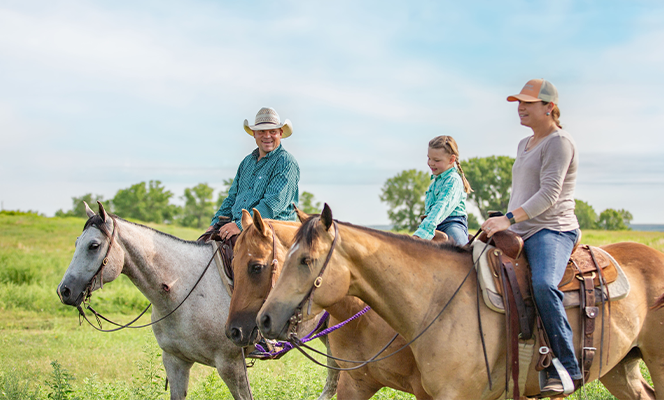 Family riding horses