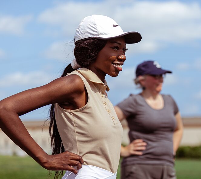 girls playing golf