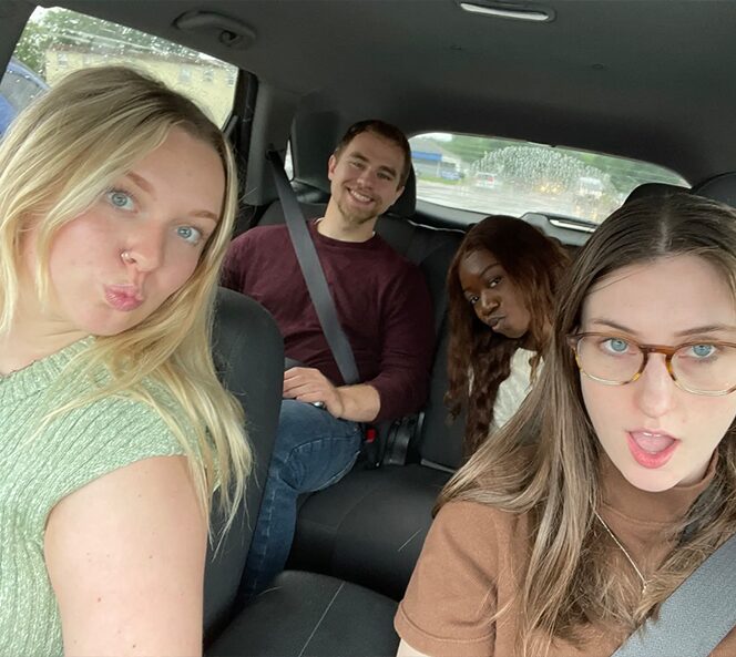 group of interns in a car