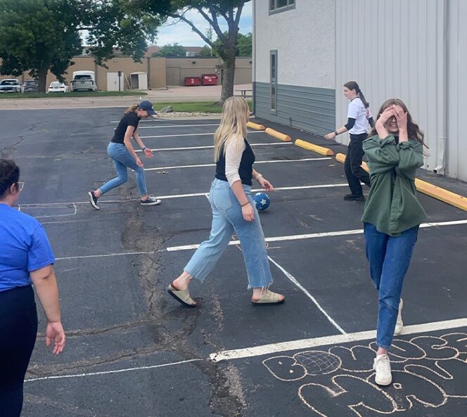 group of people playing four square