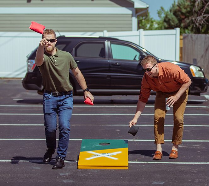 two men playing corn hole