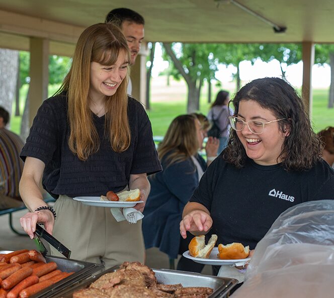 two girls at grill out