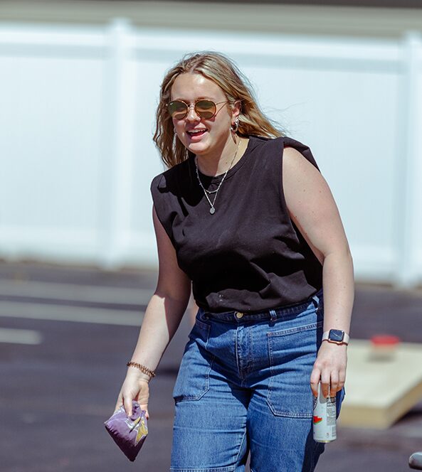 woman playing corn hole